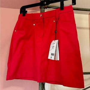 Cute lyric skort!  Reddish/pink in color. Size 2